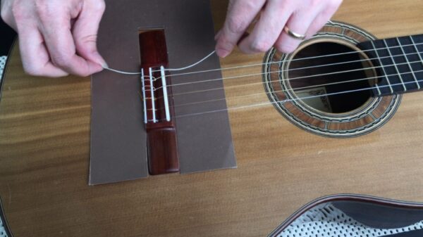 How to change strings on classical guitar